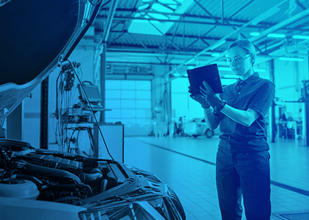 Mechanic fixing a recall on a car at the dealership